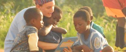 A volunteer reading to children at her Childcare Project in Ghana A Projects Abroad volunteer reading to children at her Spring Break Childcare Project in Ghana